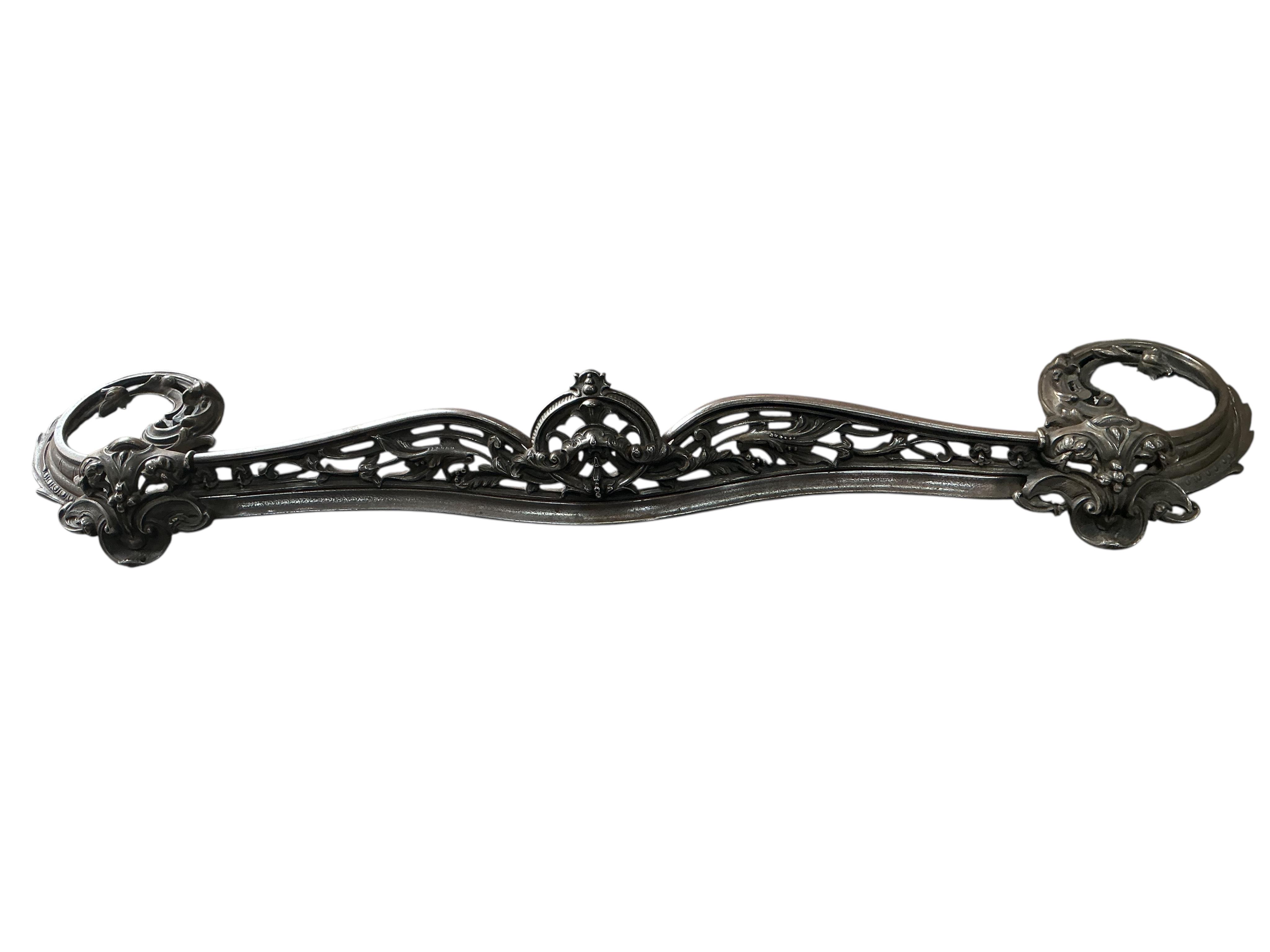 A Victorian polished steel serpentine fender, width 144cm
